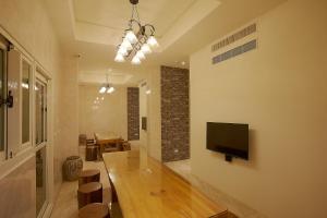 TV a/nebo společenská místnost v ubytování 大鵬灣瞭望台 Top Bay B&B