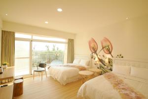 Llit o llits en una habitació de 大鵬灣瞭望台 Top Bay B&B
