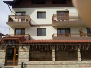 a large white building with balconies on top of it at Mineral 56 in Banya