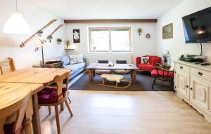 a living room with a couch and a table at Haus Sonneneck in Fügen