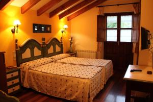 A bed or beds in a room at Casa Carielda