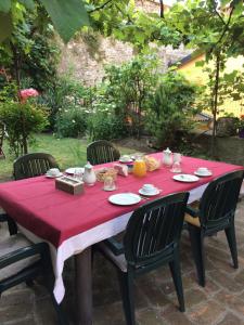A garden outside Casa Mario Lupo - Apartments and Rooms