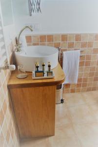 a bathroom with a tub and a sink at El Rincon del Cuera in Parres de Llanes