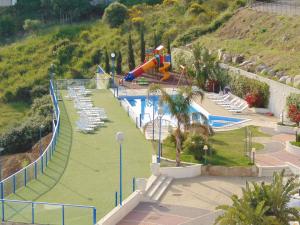 a pool with a water park with a slide at Tus'Hotel in Castel di Tusa
