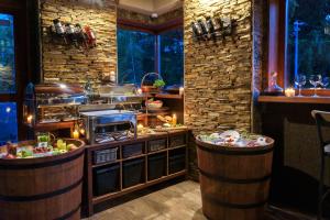 a kitchen with a counter with food on it at PinusVillas Private Jacuzzi & Phyto-Sauna in Zheleznitsa