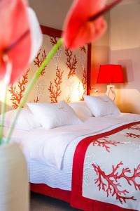 Voodi või voodid majutusasutuse Hotel Lemongarden - Adults Only toas