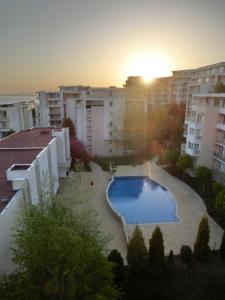 a large swimming pool in the middle of a building at Panoramic Sea View Apartment Crown, Pools and Beach, Sveti Vlas in Sveti Vlas