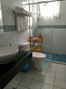 a bathroom with a sink and a toilet at Summer House Hualien Homestay in Yuli