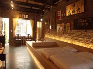 Postel nebo postele na pokoji v ubytování 和寂百年天井老房子包棟民宿wabisabi Japanese Entire Home
