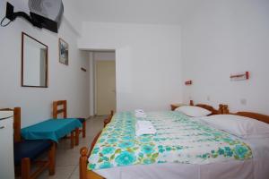 Ein Bett oder Betten in einem Zimmer der Unterkunft Nikos Rooms