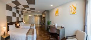 A bed or beds in a room at Hotel Parami