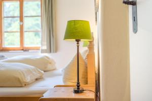 Postel nebo postele na pokoji v ubytování Berggasthof Butzn Wirt