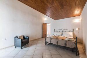 a bedroom with a bed and a television in it at Domus Chiara in Monopoli