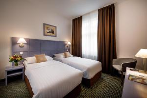 Posteľ alebo postele v izbe v ubytovaní Central Hotel Prague