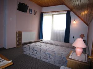 Ein Bett oder Betten in einem Zimmer der Unterkunft Fanni Guest House