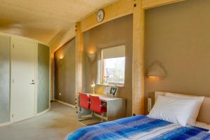 Ένα ή περισσότερα κρεβάτια σε δωμάτιο στο Strohotel Aalshof