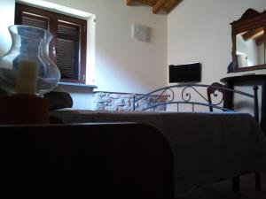 a dining room with a table with a vase on it at Ca Giacomo in Tresana