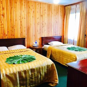 Postel nebo postele na pokoji v ubytování Single Tree Hotel