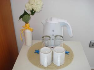 Príslušenstvo na prípravu kávy alebo čaju v ubytovaní The Sunny Home Guesthouse