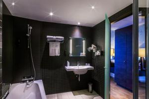 Ein Badezimmer in der Unterkunft Hotel Artemis Amsterdam