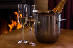 two glasses of wine and a bucket of champagne at Chalet Tara in Morzine