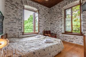 Posteľ alebo postele v izbe v ubytovaní Archontiko Montana