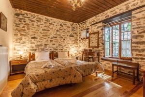 Posteľ alebo postele v izbe v ubytovaní Archontiko Montana