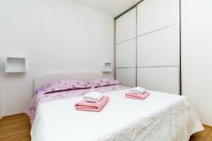 Postel nebo postele na pokoji v ubytování Apartman Duje