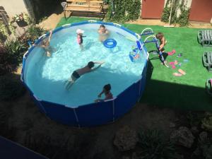 a group of people playing in a swimming pool at Aura in Zatoka