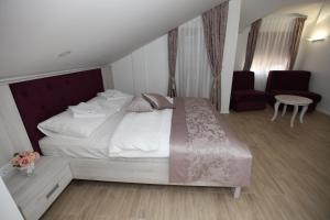 Voodi või voodid majutusasutuse Apis Hotel toas