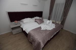 Voodi või voodid majutusasutuse Apis Hotel toas