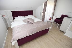 Voodi või voodid majutusasutuse Apis Hotel toas