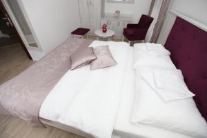 Voodi või voodid majutusasutuse Apis Hotel toas