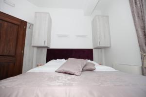 Voodi või voodid majutusasutuse Apis Hotel toas