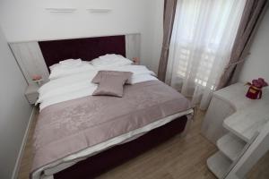 Voodi või voodid majutusasutuse Apis Hotel toas