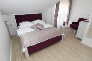 Voodi või voodid majutusasutuse Apis Hotel toas