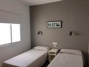 Katil atau katil-katil dalam bilik di Bungalows Villas Blancas