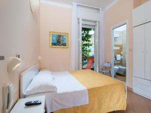 Postel nebo postele na pokoji v ubytování Hotel Miramare