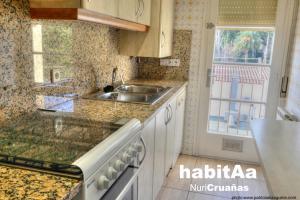 a kitchen with a sink and a counter top at Quintas de Sant Pol, a 50 metros de la playa de Sant Pol E29049 in Sant Feliu de Guíxols