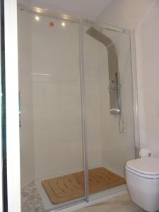 a shower stall in a bathroom with a toilet at Suites Margot in Santa Margherita Ligure