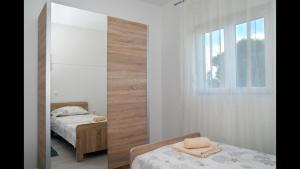 Posteľ alebo postele v izbe v ubytovaní Holiday Home Luka + 37 fotografií