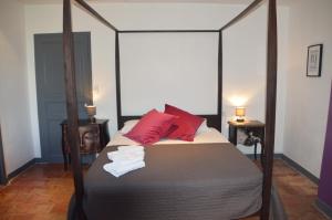 מיטה או מיטות בחדר ב-Le Voyageur - Chambres d'Hôtes
