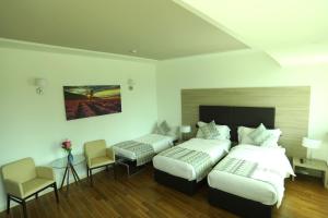 Postel nebo postele na pokoji v ubytování Hotel Nuvola