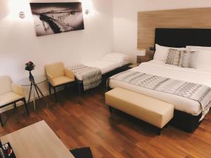 Postel nebo postele na pokoji v ubytování Hotel Nuvola