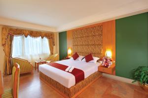 a bedroom with a large bed in a room at The Classik Fort in Cochin