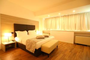 Postel nebo postele na pokoji v ubytování Hotel Nuvola