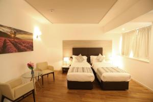 Postel nebo postele na pokoji v ubytování Hotel Nuvola