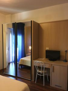 Кровать или кровати в номере Hotel Grifone