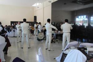 a group of men in white standing in a room at Hotel Real de San Antonio in Estanzuela