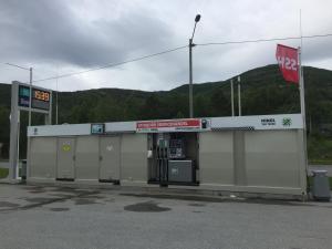 a gas station with machines in a parking lot at Tysfjord Hotel in Storjord I Tysfjord